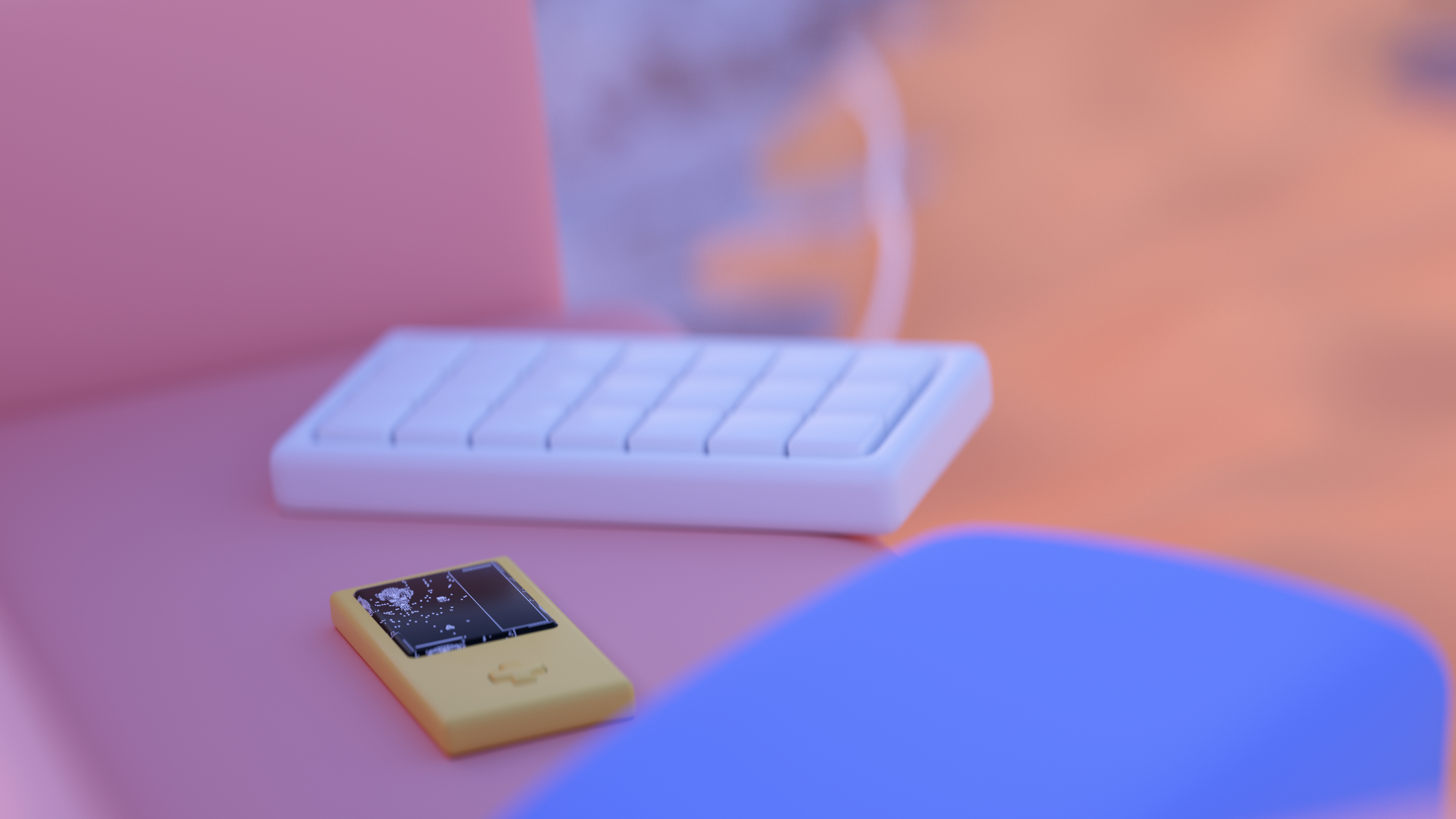 Close-up of a keyboard and a gameboy sitting on a couch