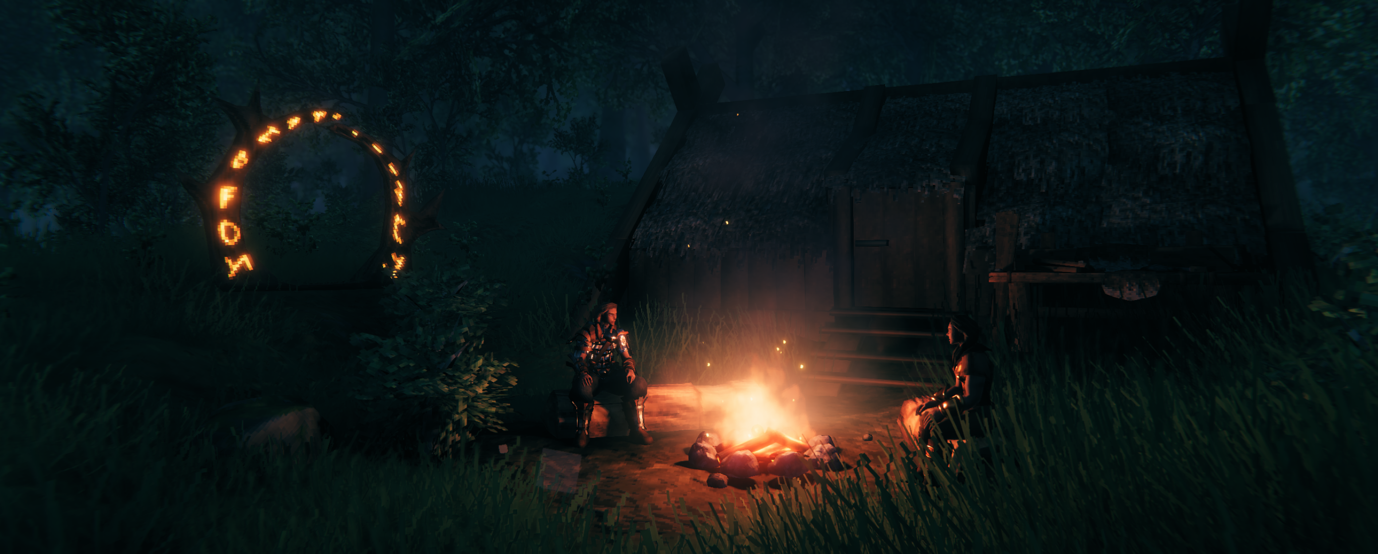 Two Valheim vikings resting around a camp fire during the nighttime.